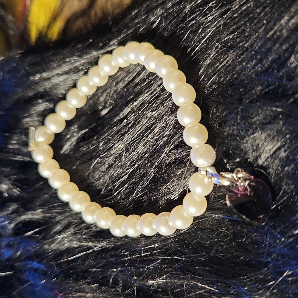 By Krafty_Korner Handcrafted beaded charm bracelet made on a stretchy cord